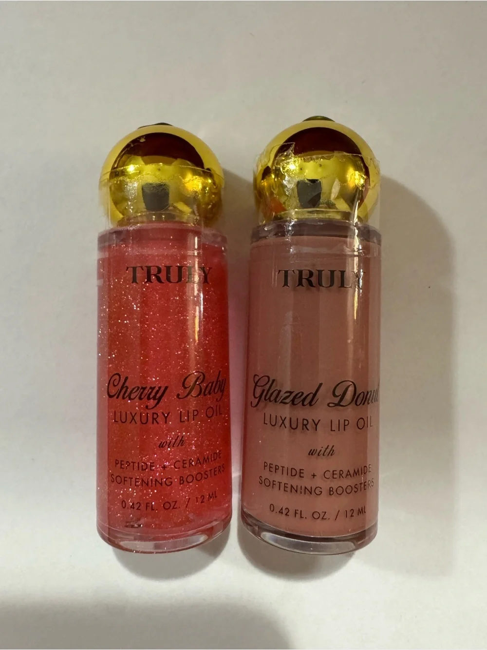 TRULY Cherry Baby & Glazed Donut Lip Oil Duo - Sparkling Pink & Nude Beige